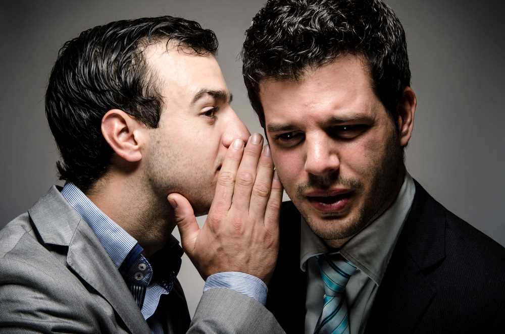 What Is Defamation Image of whispering words, featuring 411 Personal Injury Law, and highlighting the topic 'What Is Defamation,' ensuring it aligns with the page's context on legal protection against false statements.